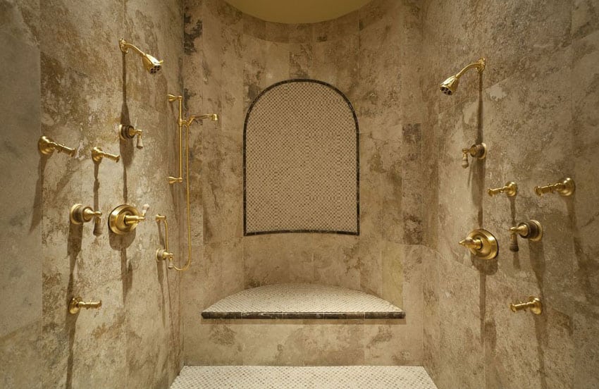 luxury travertine shower with gold fixtures